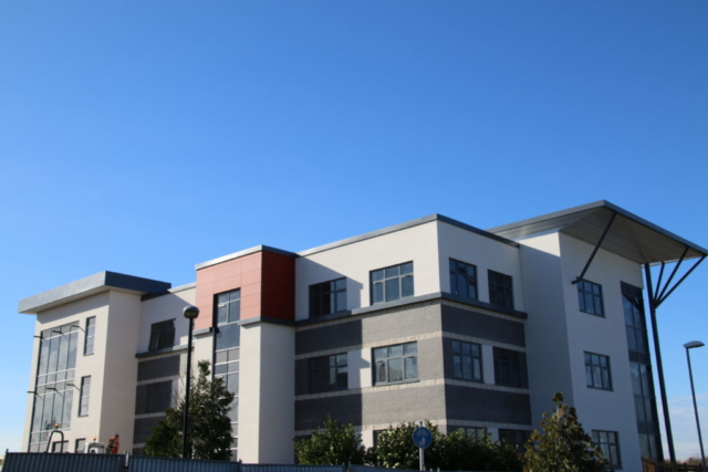 Flat roofing on a residential building with unique details and metal work